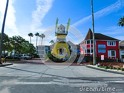 Siesta Key, USA - May 11, 2018: Typical Florida home in the countryside with palm trees, tropical plants and flowers Editorial Stock Photo