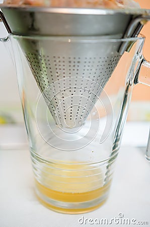 Sieving tomato essence Stock Photo