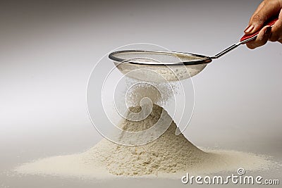 Sifting Flour Stock Photo