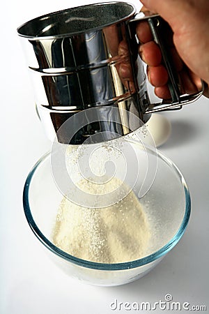 Sifting flour Stock Photo