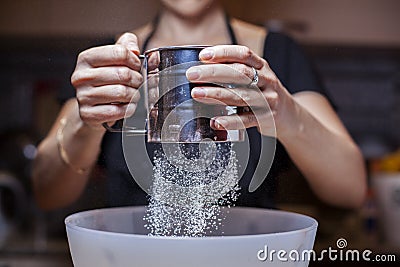 Sifting flour Stock Photo