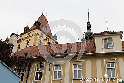 Fragment of the building above the entrance to the old city of Sighisoara in Romania Editorial Stock Photo