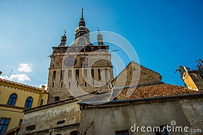 Sighisoara, Romania: Old building in Sighisoara citadel. Tower Clock in Sighisoara Stock Photo