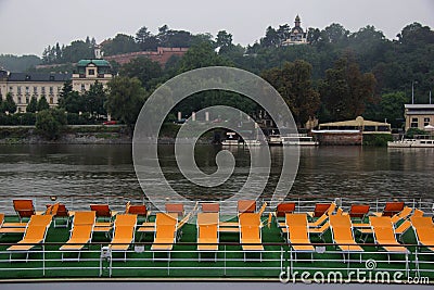 sightseeing boat with seats on the river Editorial Stock Photo