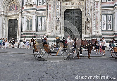 Sightseeing Carriage front of Battistero from Piazza Giovanni Square of FLorence City. Italy Editorial Stock Photo