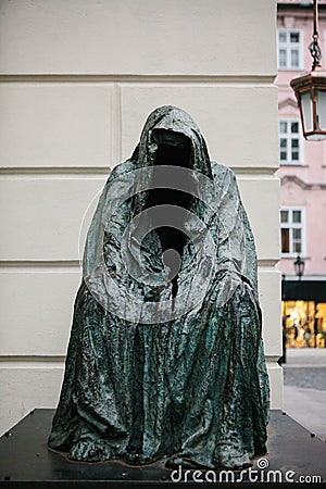 Prague, December 13, 2016: Sightseeing in Prague. Famous sculpture An empty cloak or Cloak of conscience at the entrance Editorial Stock Photo