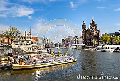 Sightseeng at Canal Boats near the Central Station of Amsterdam Editorial Stock Photo