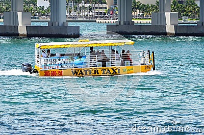 Sightseers and Commuters on a Water Taxi Editorial Stock Photo