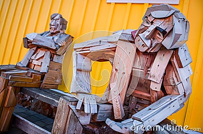 SIGLUFJORDUR, ICELAND - 15 August 2012: Sitting wooden statue with colorful background, Siglufjordur, Iceland Editorial Stock Photo