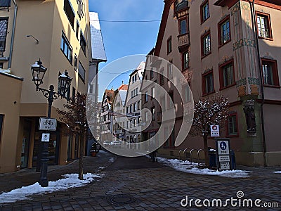 Entrance of pedestrian zone in historic city center in winter season with snow. Sign: War face mask. Editorial Stock Photo