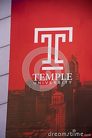 Sign advertising Temple University as seen on the side of a building in center city Philadelphia Editorial Stock Photo