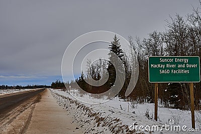 Sign on Aostra road for Suncor Mackay river plant Stock Photo