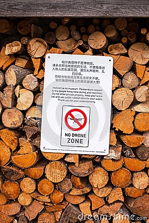 A sign on the ban on flying quadrocopters hangs on stacked wooden bars Stock Photo