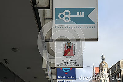 Sign board and logos on the wall of client center in Riga, Latvia Editorial Stock Photo