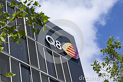 Sign on building facade with the logo of Q8, Kuwait Petroleum International. Editorial Stock Photo
