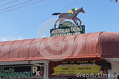 A sign on the building where betting sweepstakes are accepted in the city of Nadi on the island of Viti Levu in the Pacific Ocean Editorial Stock Photo