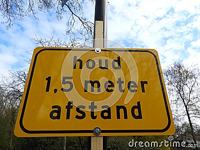 Dutch sign that says you have to stay 1,5 meter away from eachother Stock Photo