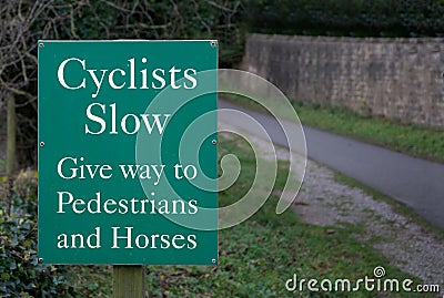 Sign - Cyclists Slow - Give Way to Pedestrians and Horses Stock Photo