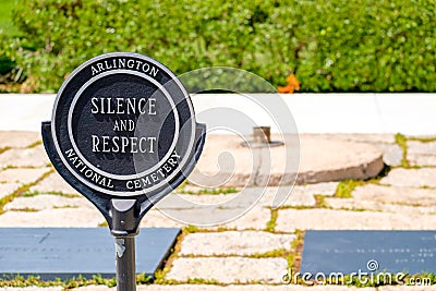 Sign demanding respect next to the Eternal Flame at the Arlington National Cemetery Editorial Stock Photo