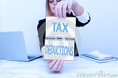 Sign displaying Tax Deductions. Word Written on an amount or cost that subtracted from someone s is income Assistant Stock Photo