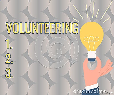 Text caption presenting Volunteering. Concept meaning Provide services for no financial gain Willingly Oblige Hand Stock Photo