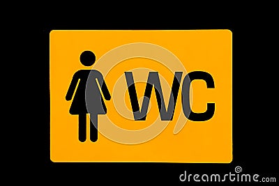 A sign on the door indicating a female toilet Stock Photo