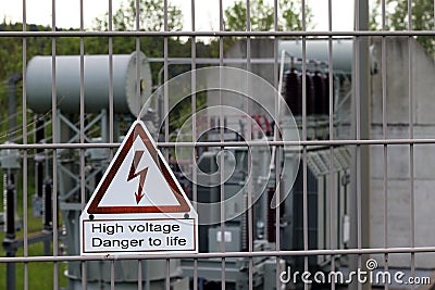 Sign on a fence - Attention High voltage Danger to life Stock Photo