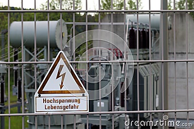 Sign on a fence - Attention High voltage Danger to life Stock Photo