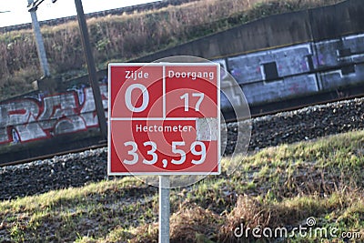 Sign for firefighters, paramedics and police where and which entrance it is to busy railroad track at Zwijndrecht. Editorial Stock Photo