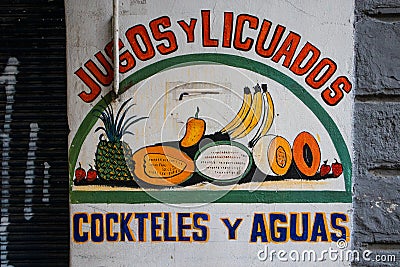 Sign for fresh juice in Mexico City. The sign translates from Spanish `Juices and smoothies, mixes and waters` Editorial Stock Photo