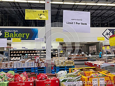 A sign in the fresh produce aisle of a Sams Club stating that customers may only buy 1 per item Editorial Stock Photo