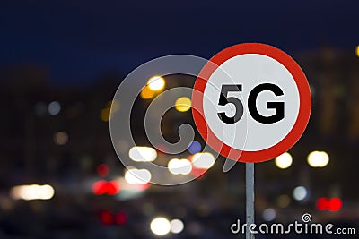 The Sign 5G and the night road with cars Stock Photo