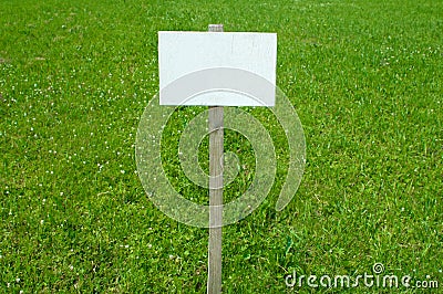 Sign on grass with space for caption Stock Photo