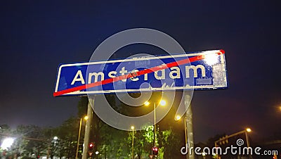 Sign indicating the end of the city of Amsterdam. Night city Stock Photo