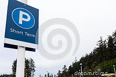 A sign indicating short term parking in a parking lot. Stock Photo