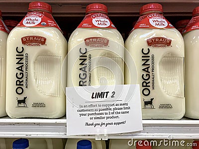 Sign informing customers that the store places purchasing limits on dairy products Editorial Stock Photo
