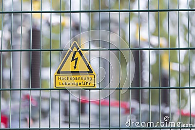 A sign with the inscription High voltage Danger to life Stock Photo