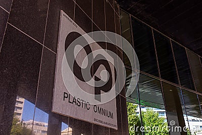 Sign and logo at the entrance to the Plastic Omnium building in Levallois-Perret, France Editorial Stock Photo