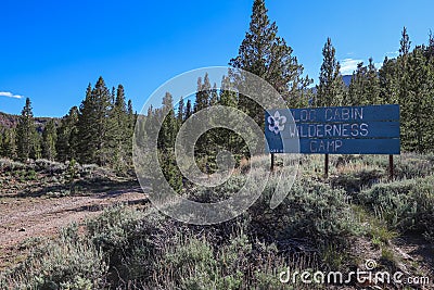 A sign marking the Boy Scouts' Log Cabin Wilderness Camp site Editorial Stock Photo