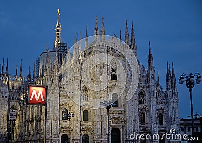Sign metro station in Milan Italy with church on the background Editorial Stock Photo