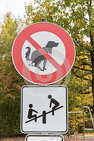 Sign No Dog Poop in a playground Stock Photo