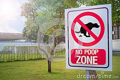 The Sign no poop zone close up image in garden day light flare. Stock Photo