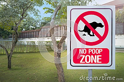 The Sign no poop zone close up image in garden day light flare. Stock Photo