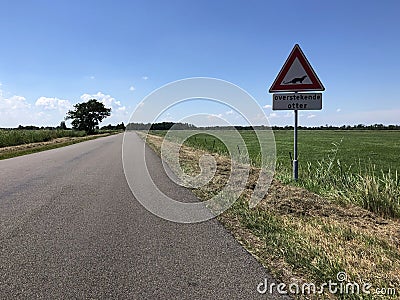Sign from a otter crossing the road Stock Photo