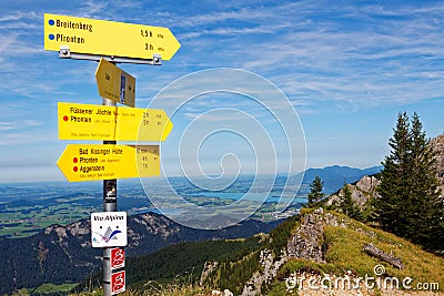 Yellow signposts on mountain top by panoramic view Stock Photo