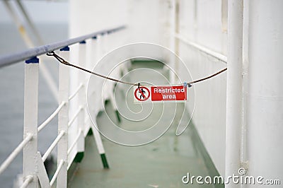 Sign prohibited on white deck of the ship Stock Photo