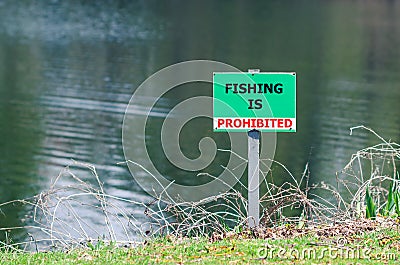 A sign prohibiting fishing in the pond Stock Photo