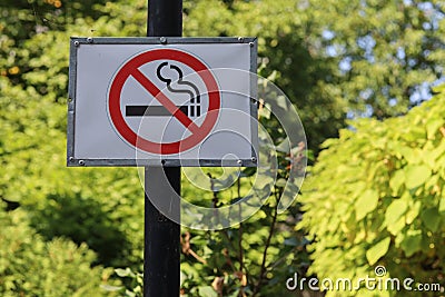 Sign in a public place informing that smoking is prohibited Stock Photo