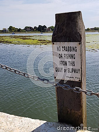 No crabbing or fishing sign on jetty. Stock Photo