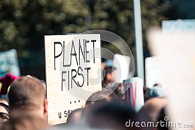Planet first sign on climate change demonstration Editorial Stock Photo
